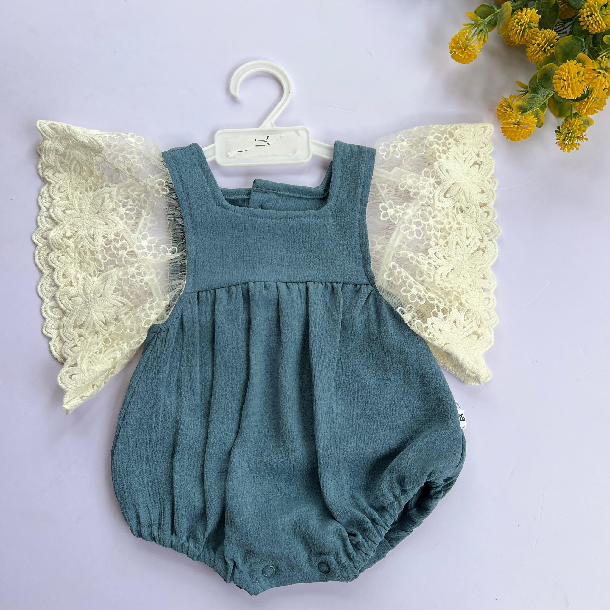 Sage angel wing romper.