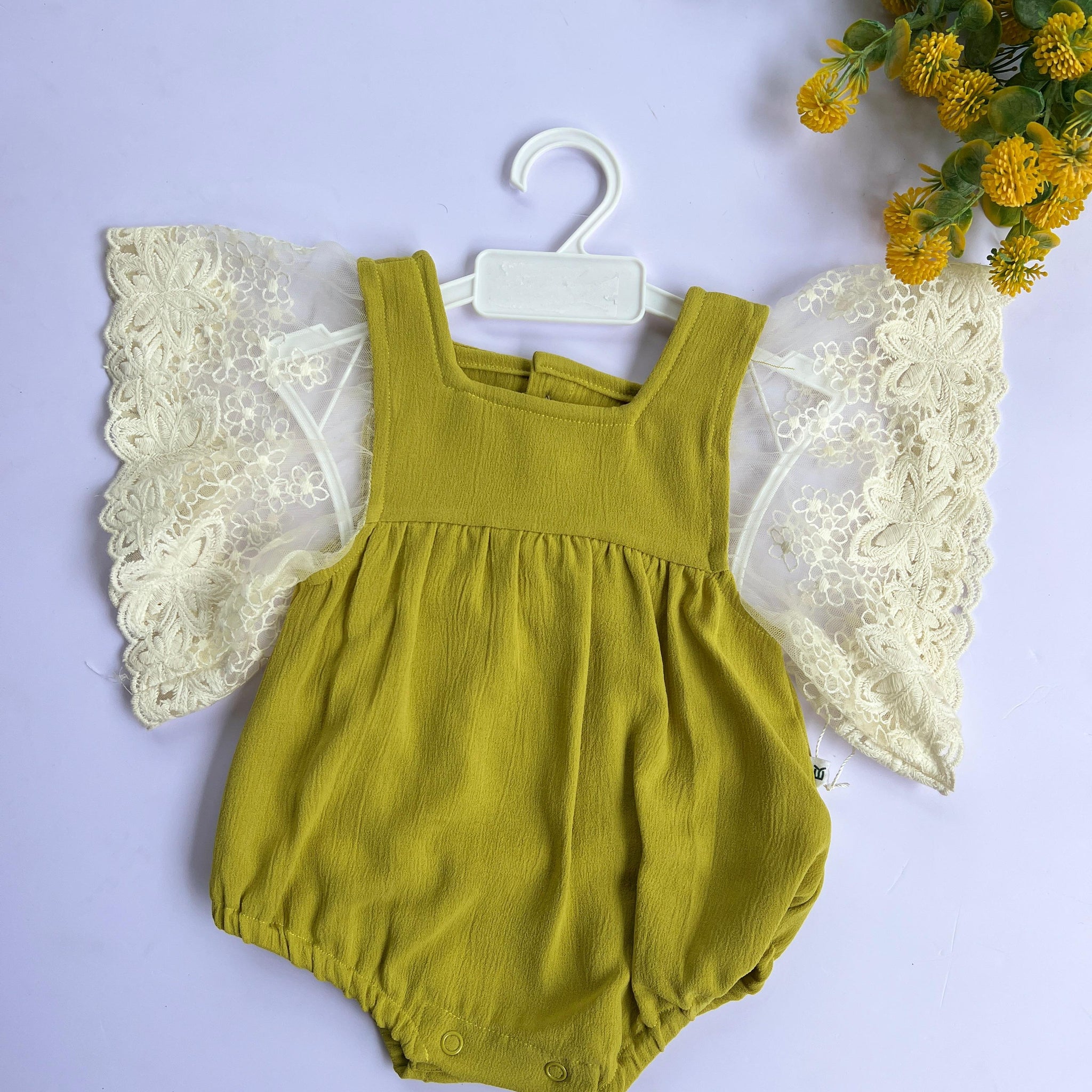 Golden angel wing romper.