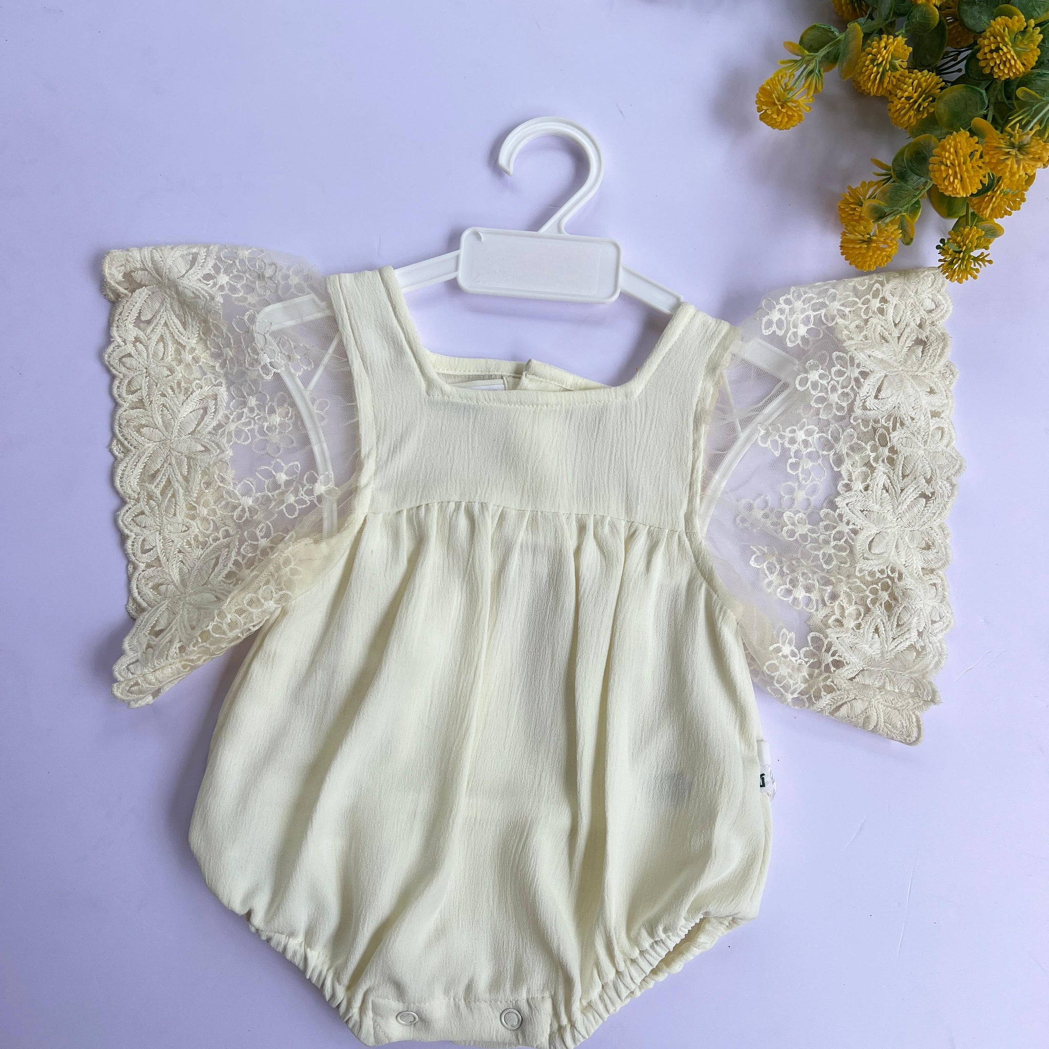 Ivory angel wing romper.