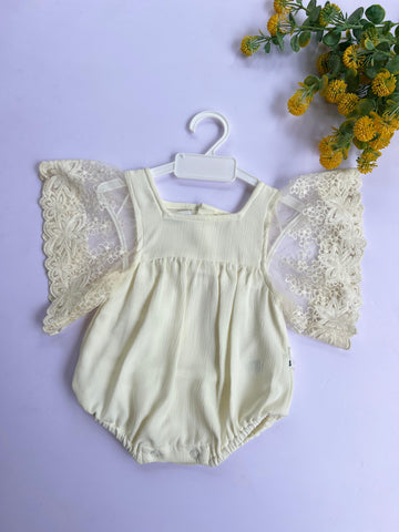 Ivory angel wing romper.